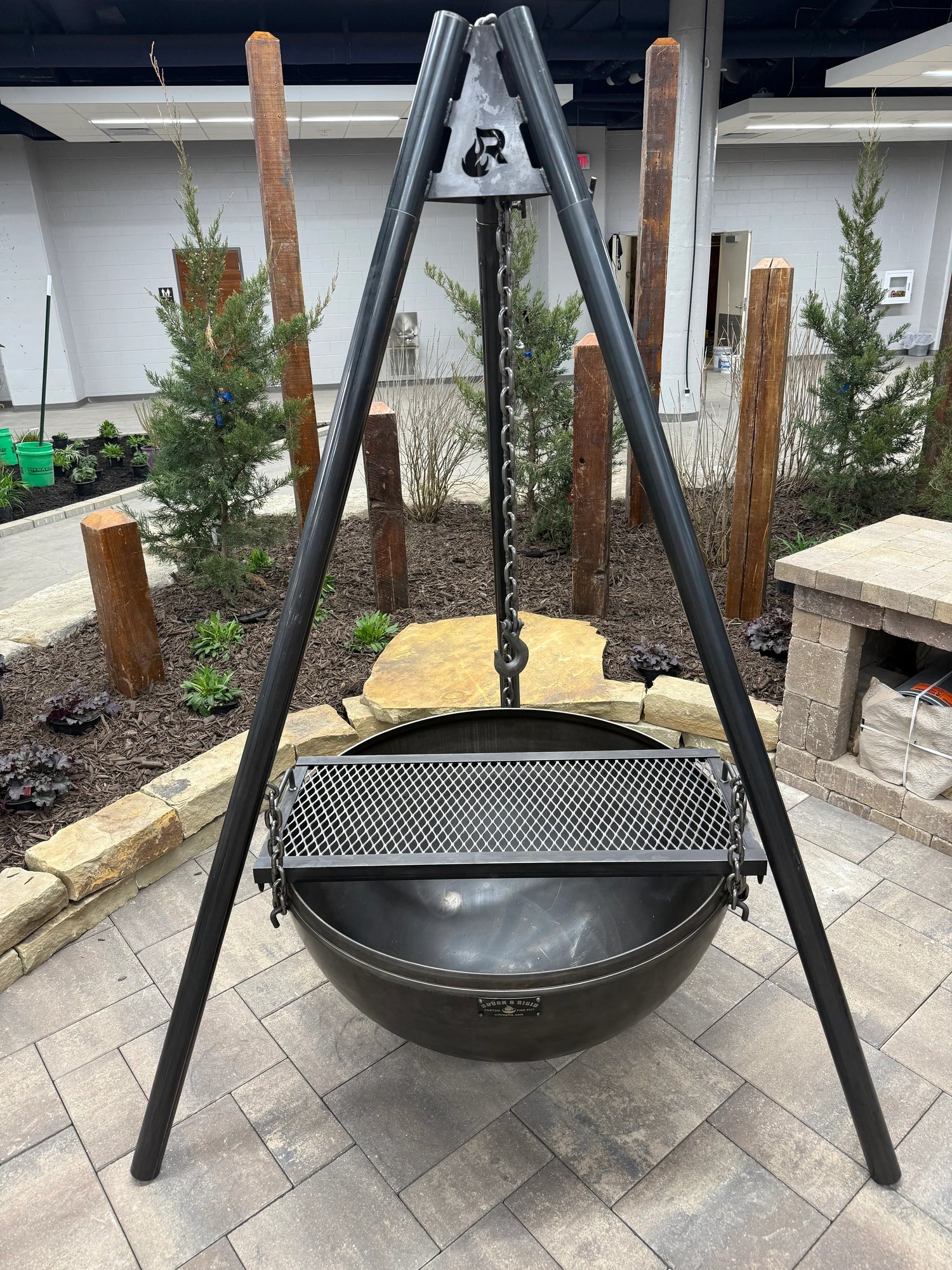 Full View of Grill Grate Laying across Fire Bowl of Hanging Tripod Fire Pit Model - Rough & Rigid