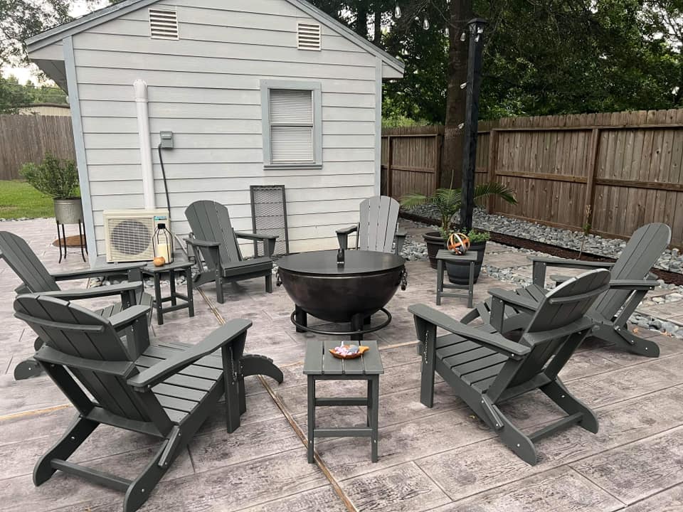 Heavy-Duty Steel Fire Pit With Tilting Base surrounded by adirondack easy-exit chairs - Rough & Rigid