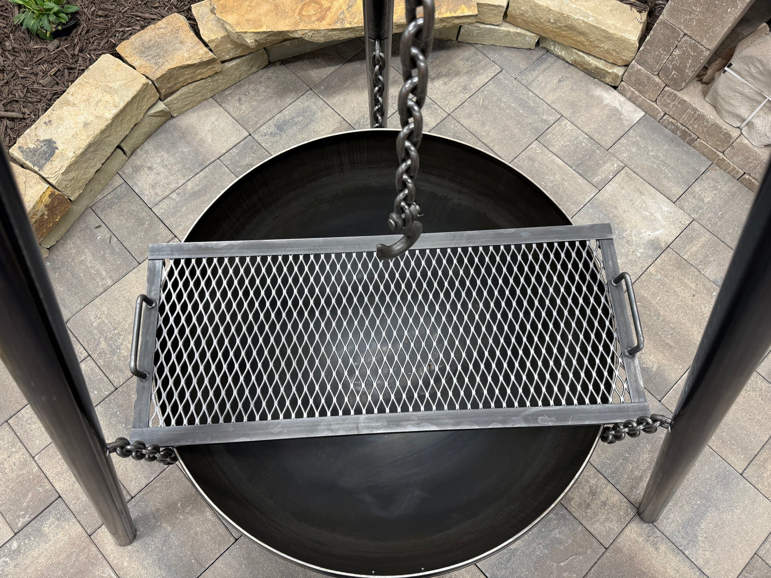 Top View - Grill Grate Placed over Fire Bowl of Hanging Tripod Fire Pit Model - Rough & Rigid