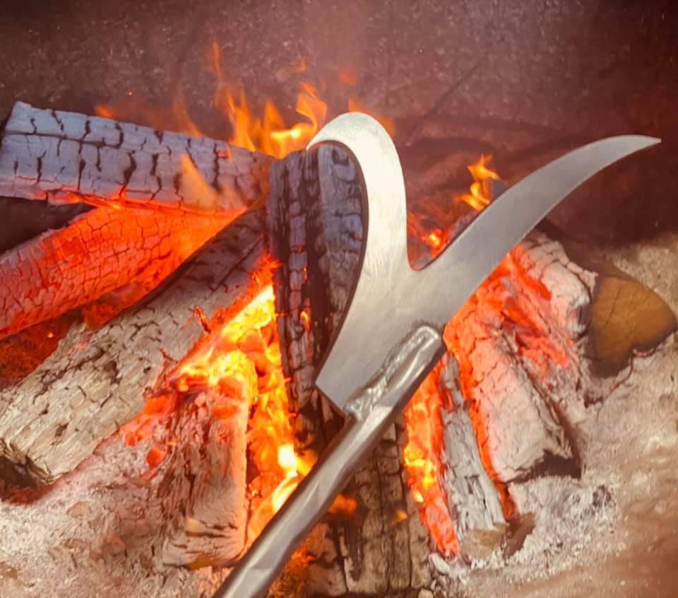 Fire Poker Poking End in Front of Roaring Fire - Rough & Rigid